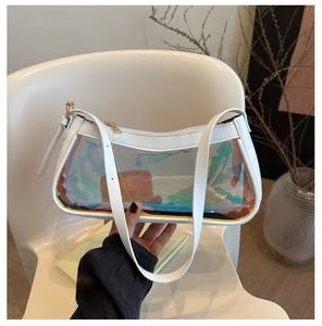Detailed view of fashionable laser transparent underarm bag with white leather straps