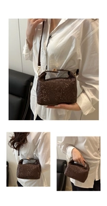 Detailed macro view of the brown snakeskin texture on this chic rectangular crossbody bag