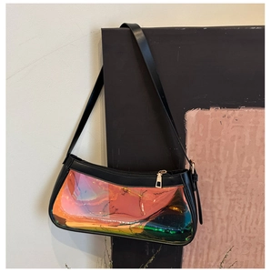Detailed macro of holographic TPU shoulder bag with black leather trim and gold hardware