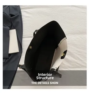 Detail view of large contrast tote bag interior showing magnetic buckle and spacious lining