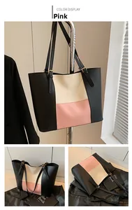 Detail of color-block tote bag in pink, beige and black PU leather with gold hardware