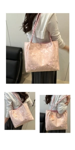 Pink tote bag detail featuring floral butterfly jacquard fabric and woven handles