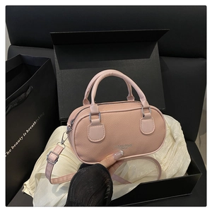 Pink litchi texture bowling bag displayed in a premium gift set with a black box