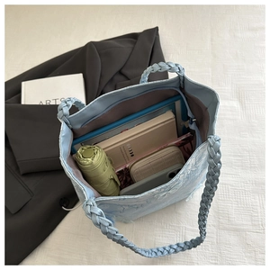 Top view of blue lace tote bag interior showing large capacity for tablet and daily items