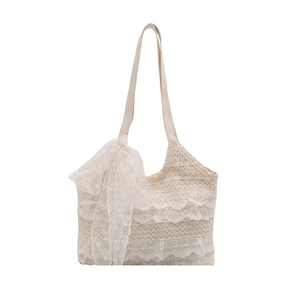 French style cream lace tote bag with delicate floral patterns and a side bow detail