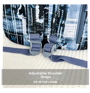 Detail of adjustable shoulder straps on blue denim graffiti school backpack with gray buckle