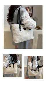 Detail of white hollow-out woven texture tote with black leather trim and metal logo