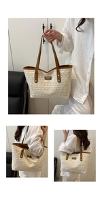 Detail of hollow woven tote bag with dark brown leather handles and brand logo tag