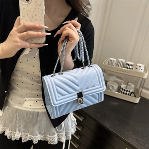 Light blue quilted chain bag with V-shaped texture and metallic buckle for women