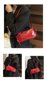 Detail der roten Lackleder-Schultertasche mit dekorativen seitlichen Schleifenakzenten