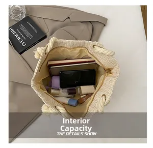 Detail view of large capacity straw tote bag with zipper closure and inner lining