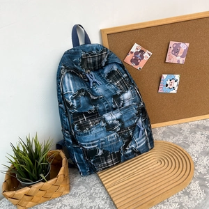 Retro graffiti patchwork denim backpack with frayed edges and large capacity for students