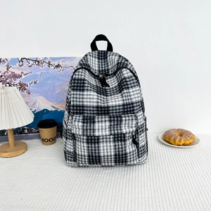 Classic black and white checkered canvas backpack with large capacity and front zip pocket