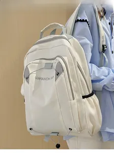 Close-up of lightweight large capacity nylon backpack with embroidered logo on model