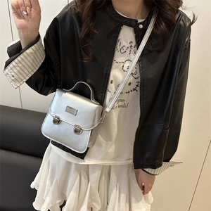 Silver mini crossbody bucket bag for women with metallic faux leather and adjustable strap