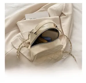 Capacity display of quilted backpack showing interior space for phone and wallet