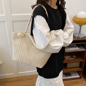 Chic beige handwoven straw tote bag with wave texture and cotton rope handles