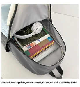 Detailed interior of the laptop backpack showing storage for A4 magazines and accessories