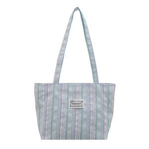 Blue and purple striped canvas tote bag with a cartoon bear label for daily school commute