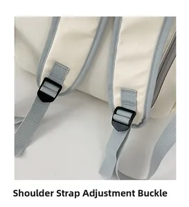 Detail showing the adjustable buckle and reinforced stitching on light canvas backpack strap