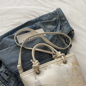 Floral embroidery canvas bucket bag with leather handles and pearl charm pendant