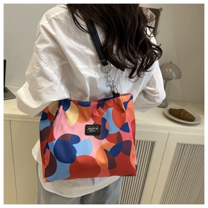 Macro detail of waterproof oxford tote bag with colorful geometric abstract dot prints