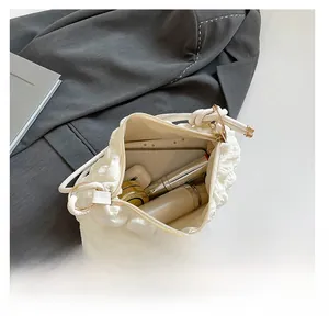 Interior view showing the large capacity of a white cloud tote bag with daily essentials