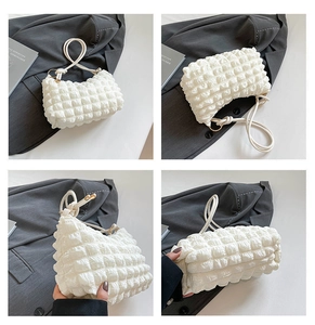 Detail views of white bubble textured tote bag with rope handles and gold rings