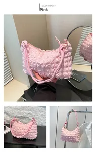 Detailed views of a pink popcorn texture puff shoulder bag with soft pleated fabric