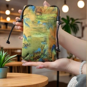 Traditional Chinese landscape style drawstring bag with green and yellow silk patterns