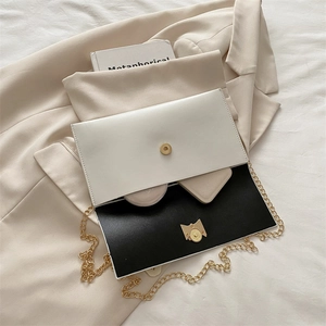 Minimalist black and white bow envelope bag with golden chain strap for women