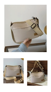 Detailed view of beige nylon crossbody bag featuring front zipper and adjustable strap