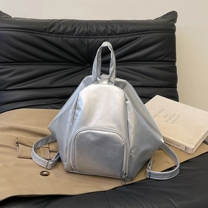 Fashionable silver metallic pleated backpack with geometric design and adjustable straps