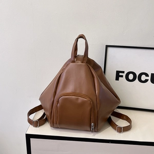 Brown faux leather backpack with geometric pleated design and front zipper pocket