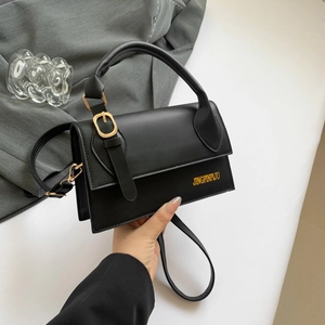 Chic black rectangular crossbody bag in matte synthetic leather with gold buckle detail