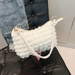 White bubble texture tote bag with gold ring accent and slim shoulder strap