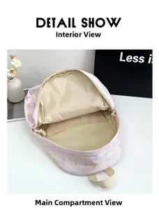 Pink cartoon backpack interior showing spacious main compartment and cat pattern