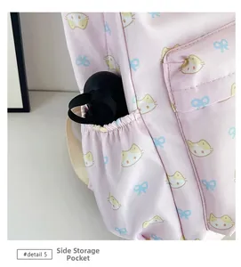 Detail of pink backpack side pocket with elastic opening showing storage for an umbrella