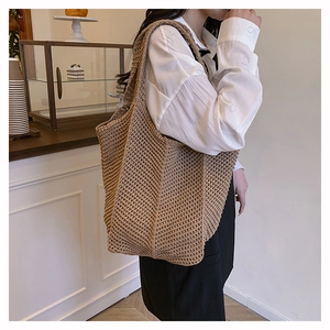 Close-up of khaki woven tote bag showing handcrafted texture and large capacity