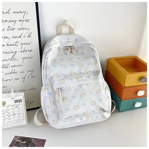 Detail of cute cat pattern backpack with large main pocket and side cup holder