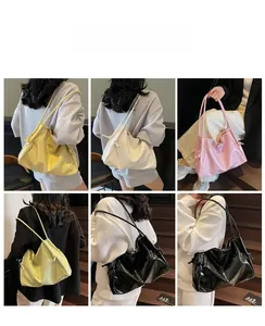 View of a large capacity tote bag in five colors shown from different wearing angles