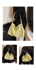 Detail of light green wrinkled patent leather tote bag with stylish knot shoulder strap detail
