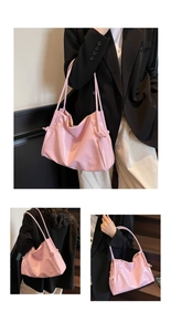 Close-up of pink glossy tote bag featuring decorative knot details and dual slim straps