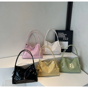 Detailed group view of five colorful glossy tote bags with knot side accents and modern finish