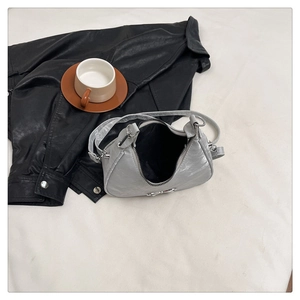 Detailed top view of silver-gray metallic hobo bag with zipper and premium lining