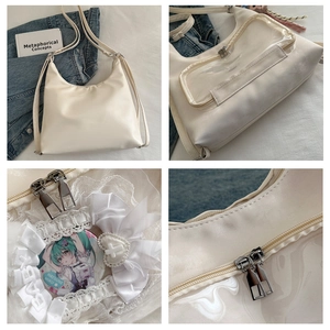 Detailed view of white PU ita bag with clear PVC window, lace trim and metal zipper
