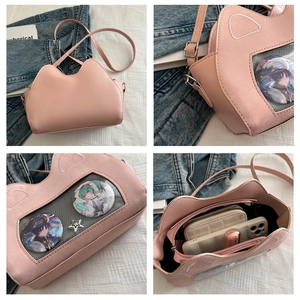 Detailed views of a pink cat-shaped ita bag featuring a clear window and cat ear design