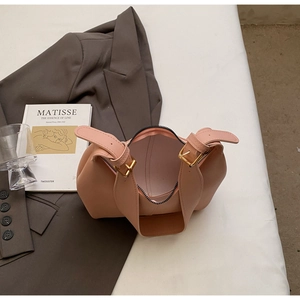 Top view of pink leather handbag showing interior space and black zipper closure details