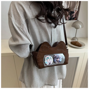 Detail view of cat-ear ita bag with transparent PVC window for anime badges