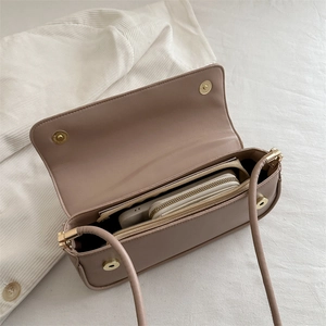 Minimalist beige PU leather crossbody bag with magnetic flap closure and daily essentials